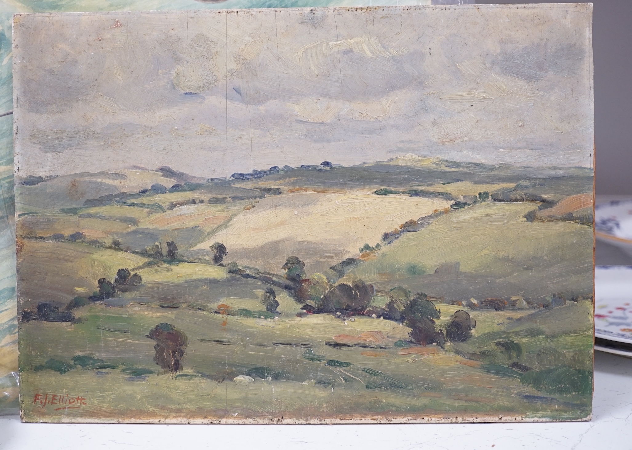 F.J. Elliott (20th. C), oil on board, Rural landscape, signed, unframed, 25 x 35cm. Condition - poor to fair, some cracking and surface dirt